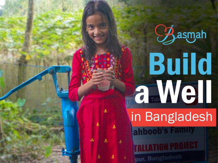 Bangladeshi family accessing safe drinking water from tested well