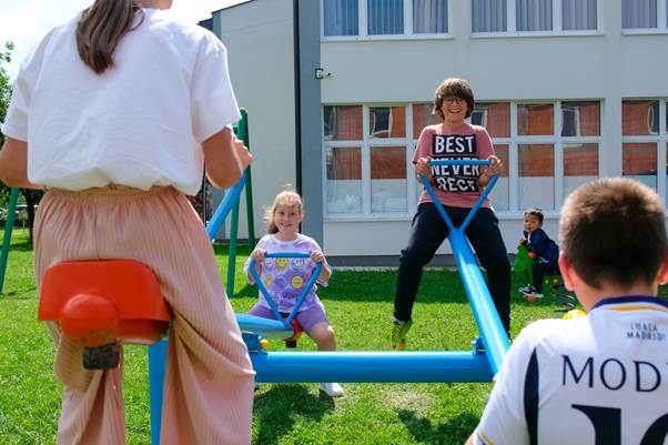 A group of children playing on a playground

AI-generated content may be incorrect.